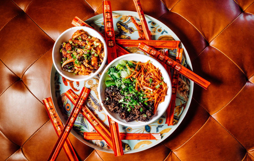 Bowl of Sura Eats food with chopsticks