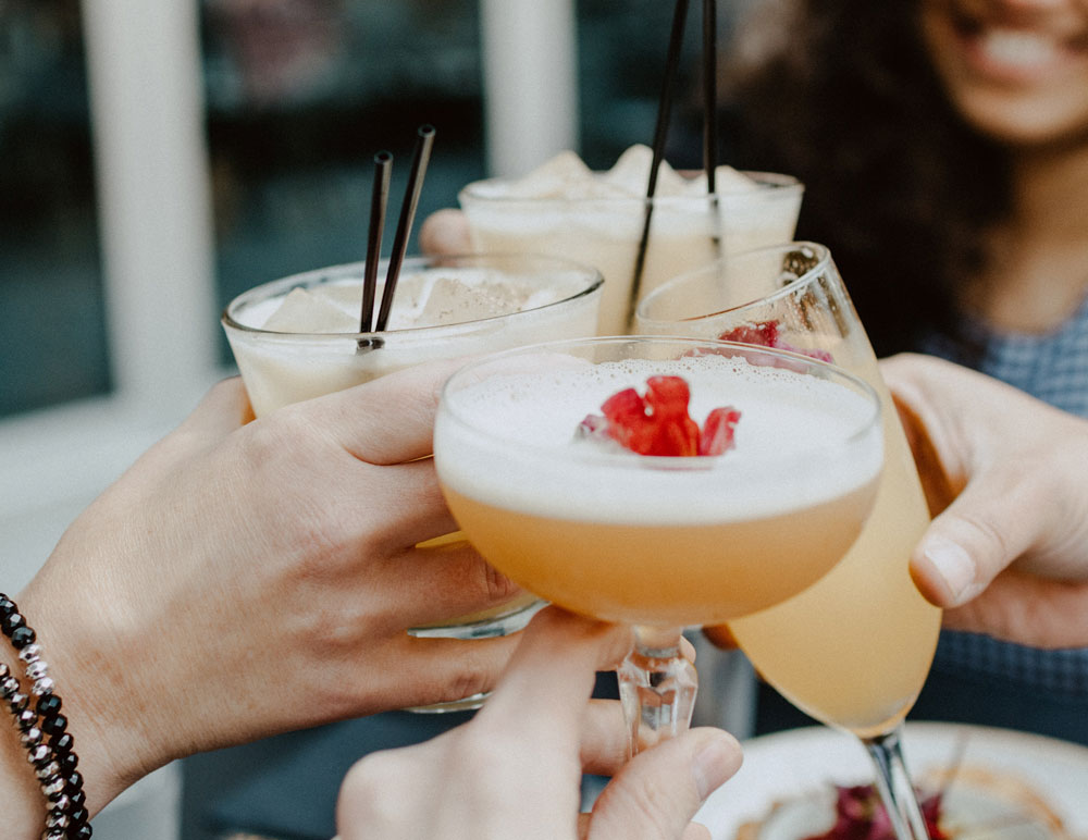 People having a cheers with cocktails